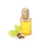 Bottle with grape seed oil on white background